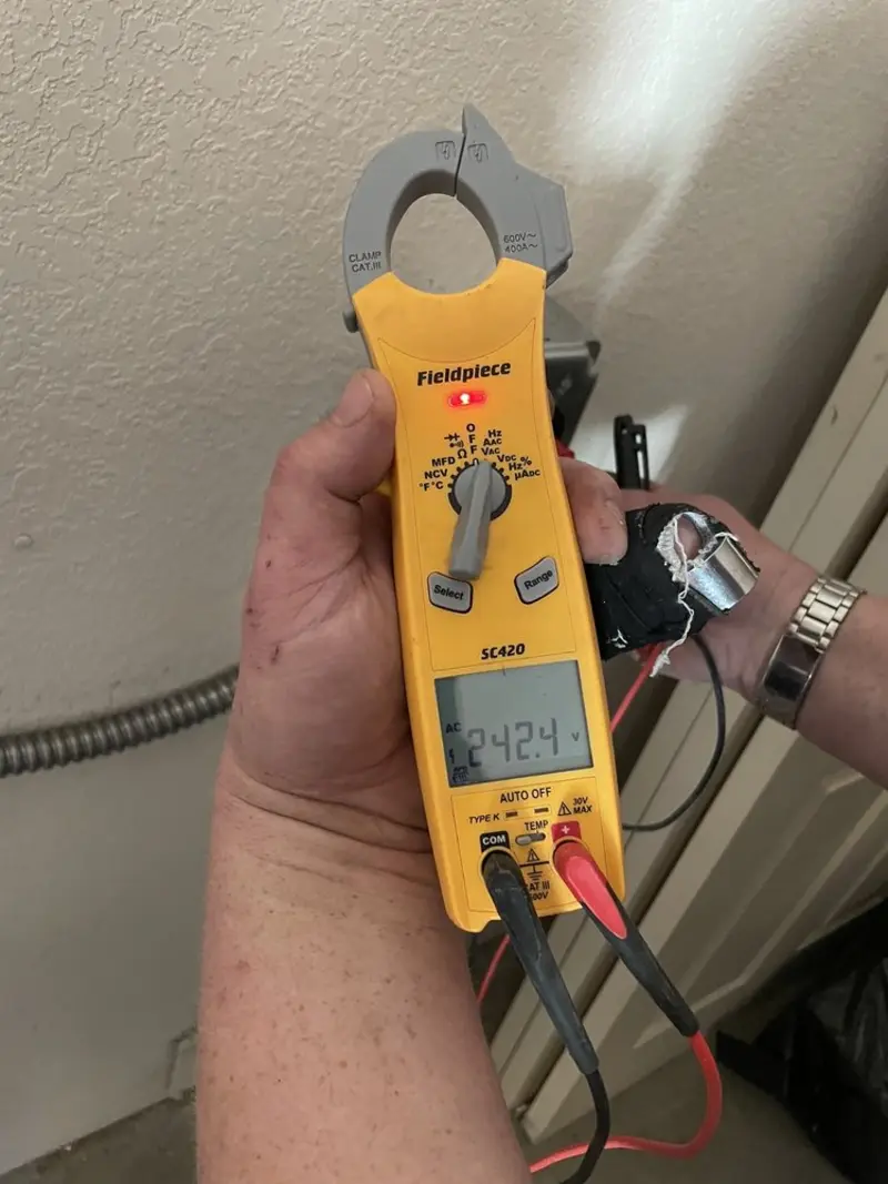 Voltage testing with clamp meter during Recessed Lighting Installation in Sterling
